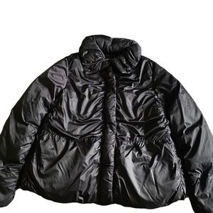 Black padded jacket with a zipper/snap closure